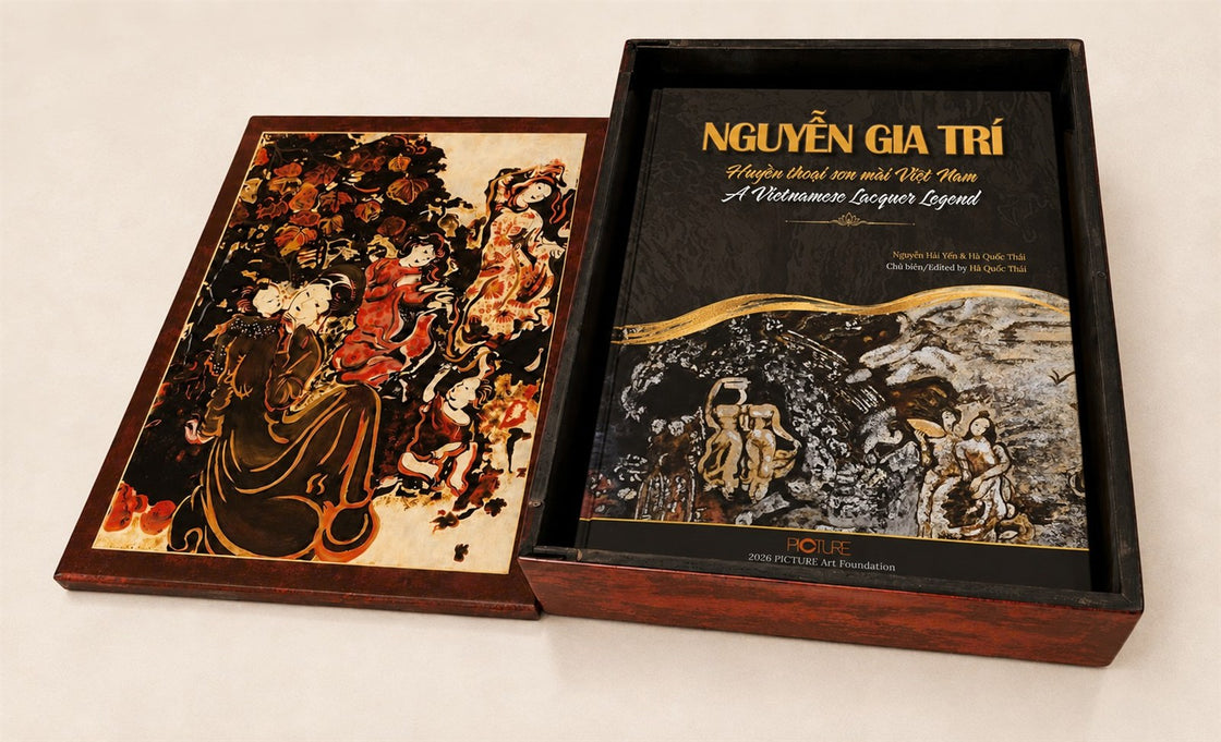The Collector's Edition box open, its lacquered lid lifted away to show the hardcover volume lying in the case